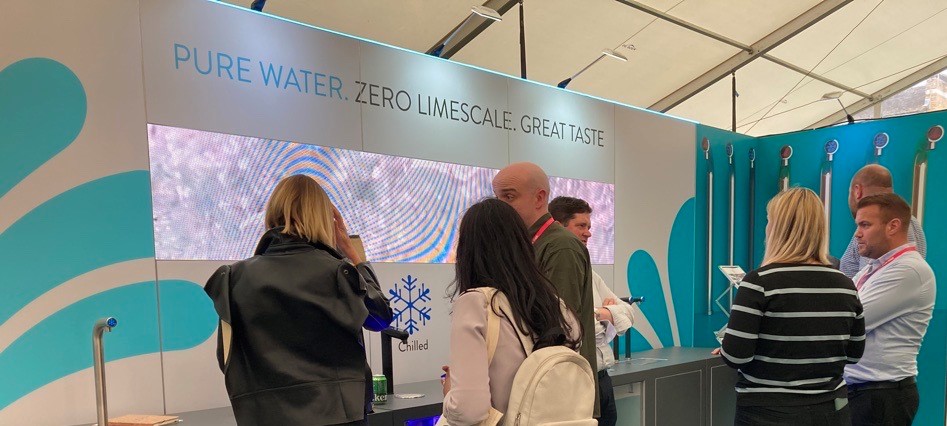 Sales team greeting visitors at CDW 2022